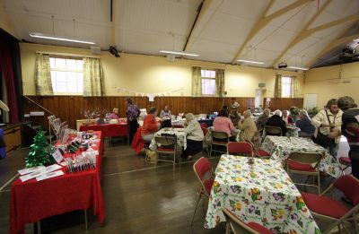 02TM016_06_03
The stalls are set up around the walls of the hall with tables and chairs in the middle for customers to have tea and cakes. 

By Tony Morris
