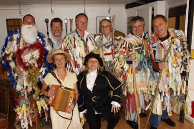 15_2SF003_2_02_01
The mummers prior to going "on stage". L to R back row: Father Christmas (Graham "Stubby" Stubbington), Bold Slasher/Valient Soldier (Peter Baker), Doctor & Lawyer (Tom Hanley), King George (Graham Tipple), Twing Twang (Paul Robinson), Turkish Knight (Harry Randle), Gill Corbet with the accordian and Jeannette the highwayman 

By Tony Morris

