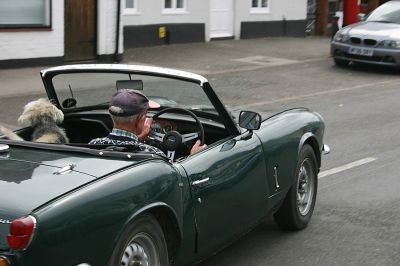 03_1WS005_9
This little terrier just loves to be driven around the village by his chauffeur, Fred (Harry) Whorton, so that he can bark a greeting to everybody he sees. It always makes me smile to see such a happy dog. Photo taken 2006 

By Tony Morris
