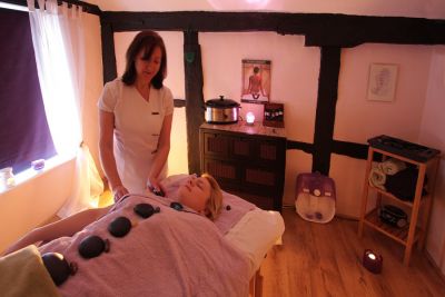 03_1WS006_7
Janine has a wide repertoire of massages, none of which I profess to understand but my wife always looks forward to a treatment with her. Here, Janine is demonstrating Hot Stone Massage for Chakra Balancing, with Jade kindly acting as the model. Pictures taken February 2010. 

By Tony Morris

