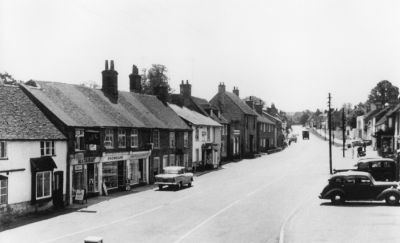 03_1WS008_5
Winchester Street. Prior to demolition next door to Wheelers and building of wine merchants. White lines have appeared in the road and a "keep left" bollard at the crossroads. Still not much traffic though. 

From Hannah Thomas

