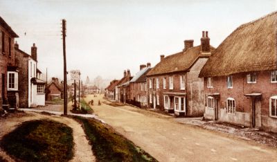 03_1WS019_0
Centre right in this view of Winchester Street, with the double bay windows, is the home of the Sprent family - (see the gallery entitled "People - Sprents and Crimbles". Between that house and the thatched cottage on the right is the very narrow Sprents Lane. Sadly this property was demolished in fairly recent times (?1960's?) and replaced by a red brick building which has little to commend it from an architectural point of view. 

From Brian Burgess and Lucy Baker
