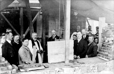 05_1CR003_04_01
c.1908 Laying the foundation stone for the new tower. Canon Stenning in robes; A Stickland, Verger (with mustache and carrying staff)to his left; W Powell in dark jacket on left; Sir William Portal, centre; front right (clean shaven) Edward Kersley. 

From Jim Stickland
