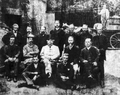 09PO007
This picture is captioned "Laverstoke Old Brigade" and dated 1880. It appears in a 2006 English Heritage publication on Laverstoke Mill. The central figure is Sir Wyndham Portal. The others are presumed to be Directors and senior managers. 

From English Heritage
