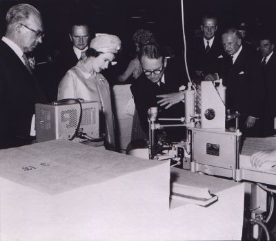 09PO033_8_10_04
Sir Francis Portal explains the counting of the paper by the Vacuumatic Automatic Counting Machine. Also in the picture, from left to right, Mr J Mason, General Manager; Mr J V Sheffield, Deputy Chairman; Lord Ashburton; Viscount Monck, Director; & Mr JC Marsden, Deputy Managing Director of Portals Limited 

From Janice Stott

