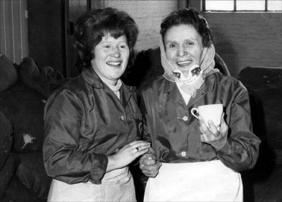 09PO037_2
Glennys Birch and Cath Smith in the "Rag House" c.1976. Glennys started working at Portals in Overton when she left school at the age of 15. She left after a few years but returned some time later and worked there in total for about 15 years. Her grandfather, father and mother all worked at Laverstoke Mill, walking to work each day from Overton. 

From Glennys Birch
