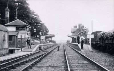 10_2TR003
The station looking east (towards London) - c.1920's. Originally there was no footbridge but there was one by 1923 for the official opening of Portals by the King & Queen. 

From Brian Burgess

