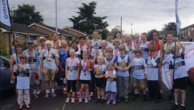 15_2SF004_2_10_27
This is a picture I pinched from the Overton Harriers 5 Mile Road Race brochure. It is shown under the caption "Overton Harriers @ the Sheepfair" although I'm not sure if all of them were actually in the procession. 

Overton Harriers
