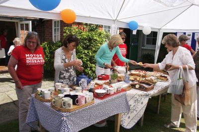 13_4ST005_08
Hilary was well supported at the opening by an efficient team of ladies. Tea and cakes on the lawn on a lovely summer's day - hard to beat. 

By Tony Morris
