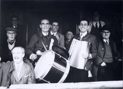 14_2OR08
Overton football supporters - with glasses on the left, Albert Baverstock - Gordie "Lot" Roberts on the drum - Derek Davis on the accordion (Names provided by John Phillimore) 

From The Basingstoke Gazette
