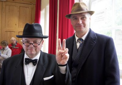 15_2SF004_1_05_01
Professional actor Derek Herbert played a very convincing Winston Churchill, with his plain clothes policeman bodyguard 

By Tony Morris

